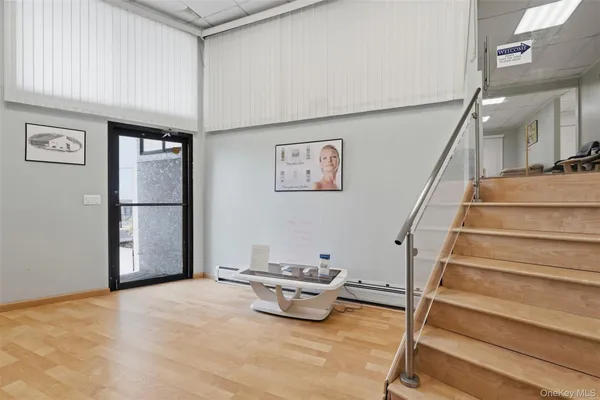 a living room with furniture and stairs