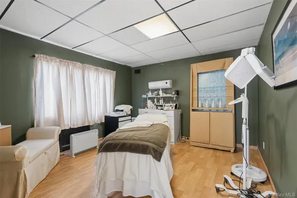 a bathroom with a toilet a sink and a mirror