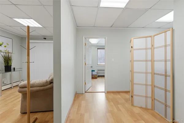 a view of a livingroom with workspace and a couch