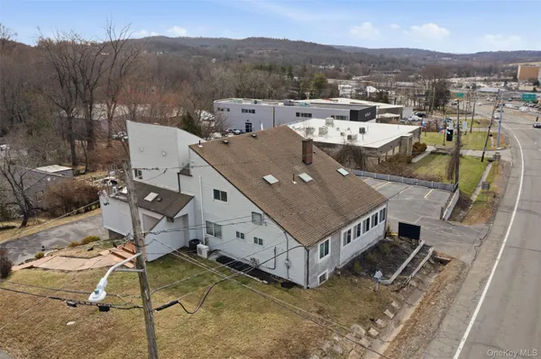 a view of a wooden chairs and table in backyard