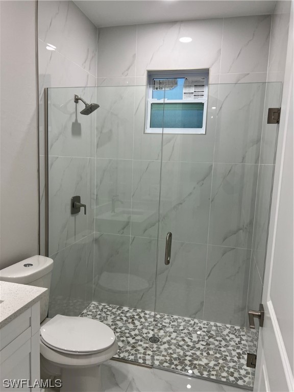 2612 16th Street West Lehigh Acres, FL 33971 - Photo 11 of 25 a bathroom with a toilet and a shower