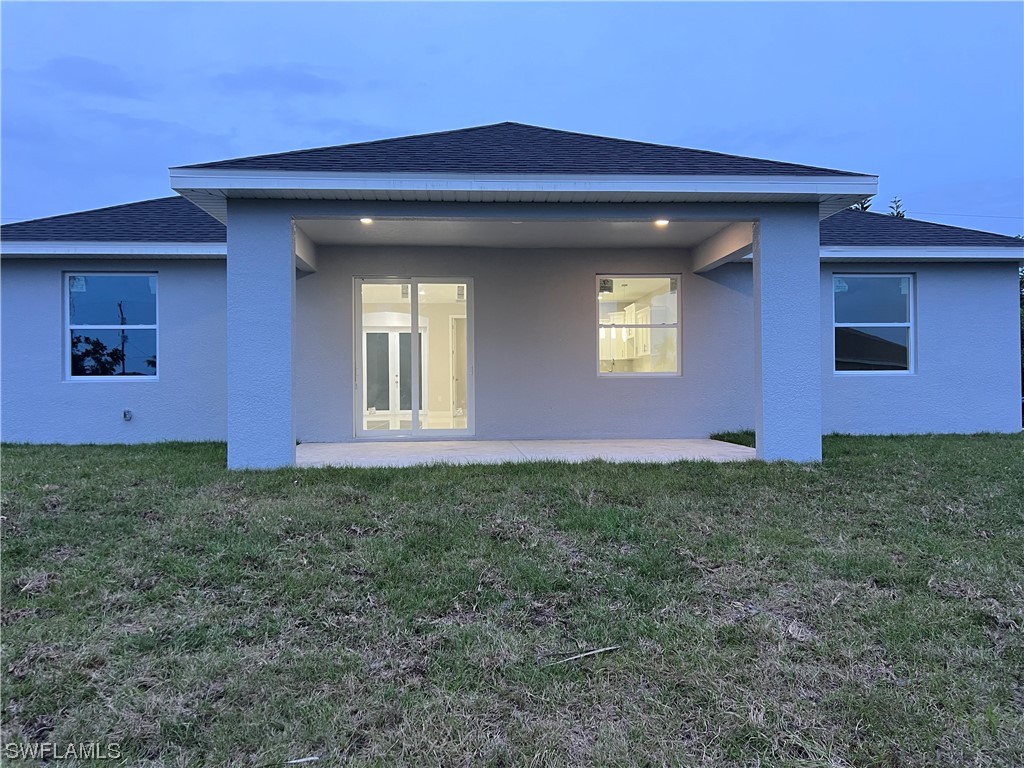 2612 16th Street West Lehigh Acres, FL 33971 - Photo 21 of 25 a view of front of a house
