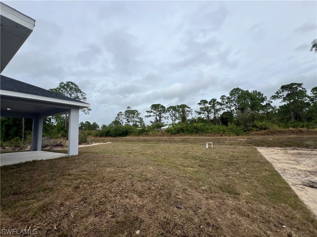 2612 16th Street West Lehigh Acres, FL 33971 - Photo 24 of 25 a view of a house with a yard