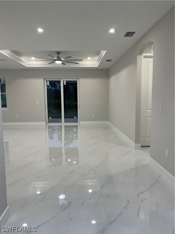 2612 16th Street West Lehigh Acres, FL 33971 - Photo 3 of 25 wooden floor in an empty room with a window
