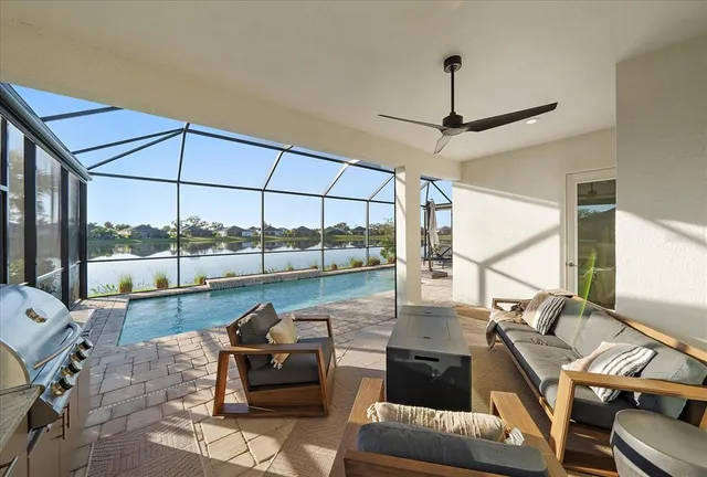 a view of swimming pool with yard and green space