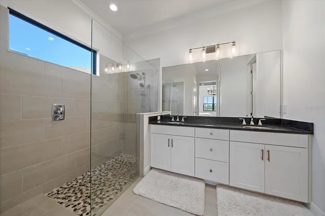 an aerial view of residential houses with outdoor space and parking