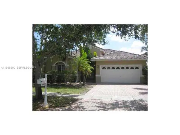 a picture of a bench in front of a building