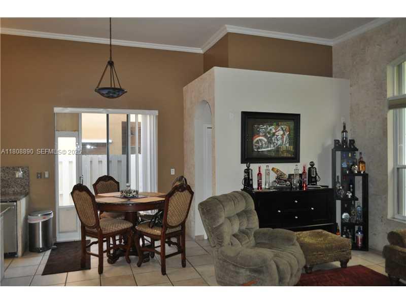 3985 Southwest 152nd Avenue Miramar, FL 33027 - Photo 11 of 26 a living room with furniture and a window