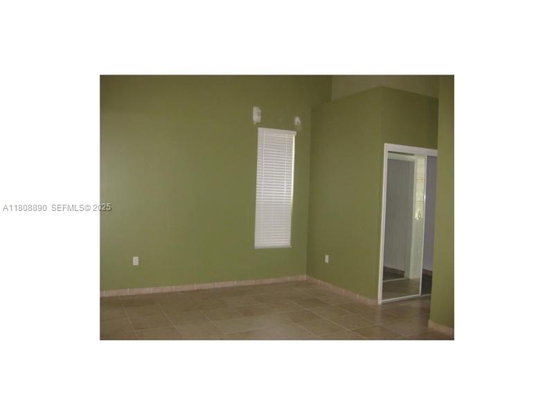 3985 Southwest 152nd Avenue Miramar, FL 33027 - Photo 18 of 26 a view of a room with wall mirror