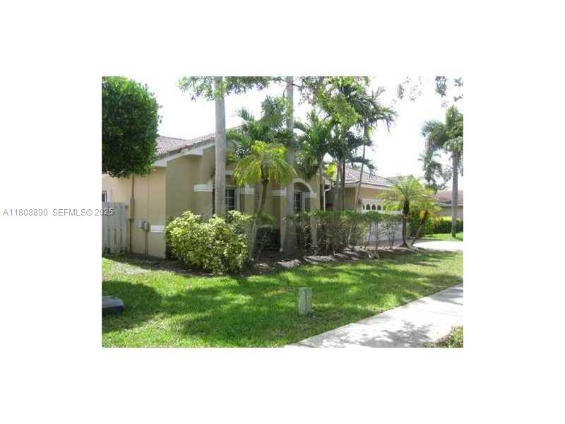 3985 Southwest 152nd Avenue Miramar, FL 33027 - Photo 2 of 26 a view of a small garden in front of a house
