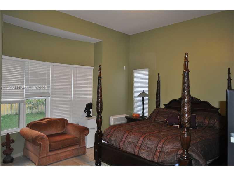 3985 Southwest 152nd Avenue Miramar, FL 33027 - Photo 21 of 26 a bedroom with furniture and a window