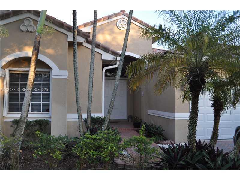 3985 Southwest 152nd Avenue Miramar, FL 33027 - Photo 3 of 26 a view of a house with a yard