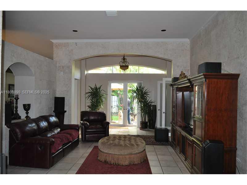 3985 Southwest 152nd Avenue Miramar, FL 33027 - Photo 4 of 26 a living room with furniture and a large window