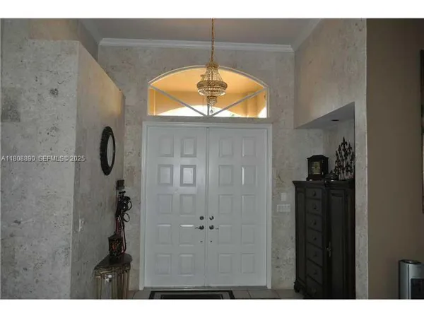 a view of a entryway door with wooden floor