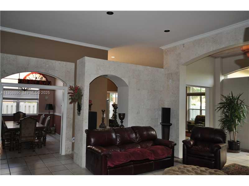 3985 Southwest 152nd Avenue Miramar, FL 33027 - Photo 8 of 26 a living room with furniture and a potted plant