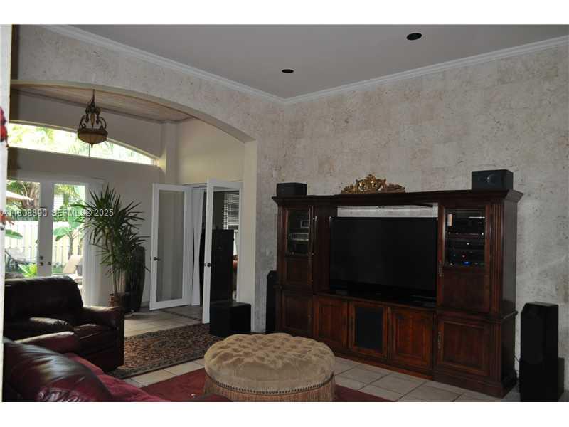 3985 Southwest 152nd Avenue Miramar, FL 33027 - Photo 9 of 26 a living room with furniture and a flat screen tv