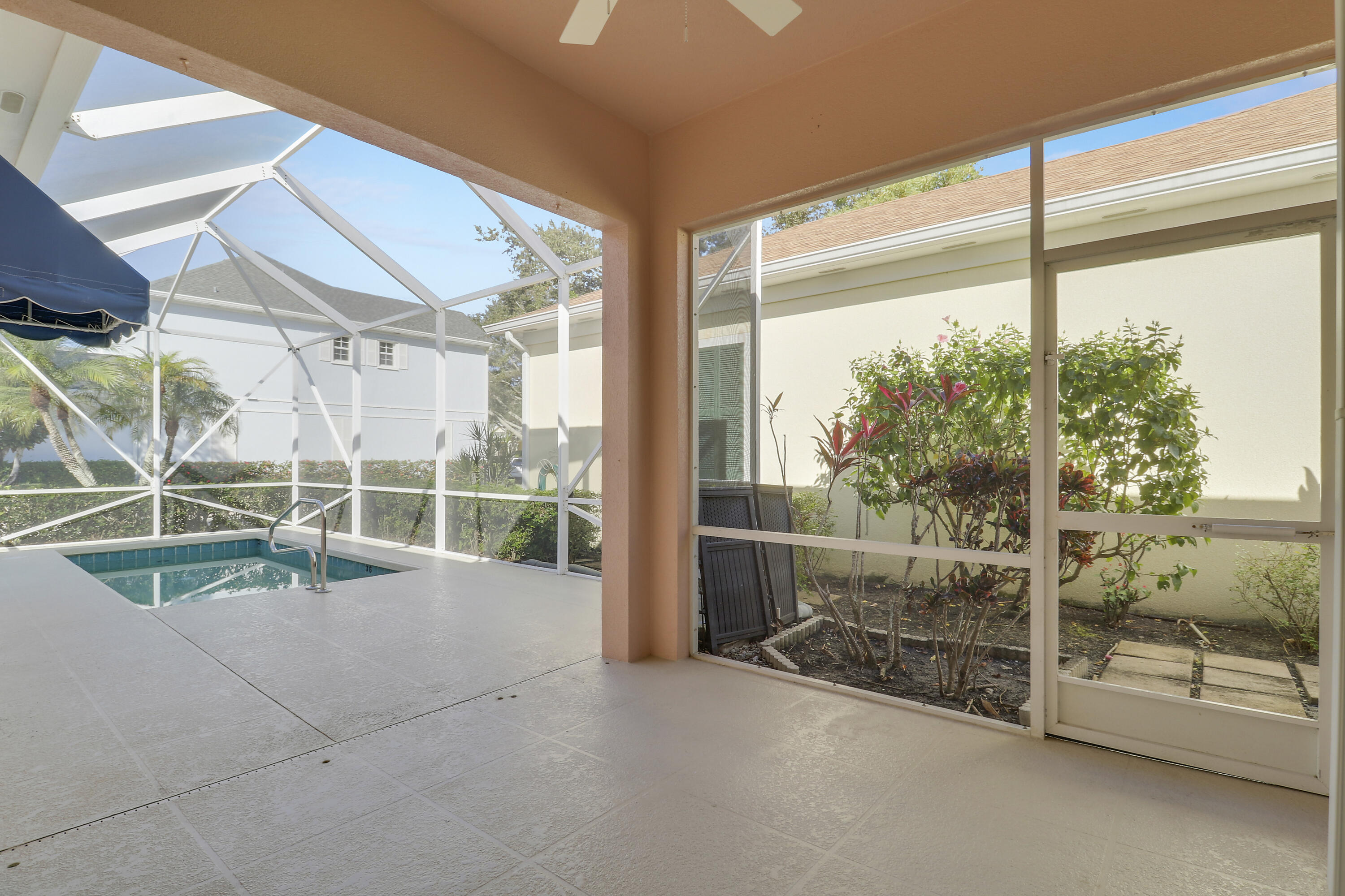 229 Sugar Apple Way Jupiter, FL 33458 - Photo 35 of 46 Covered Patio with Screen Enclosure