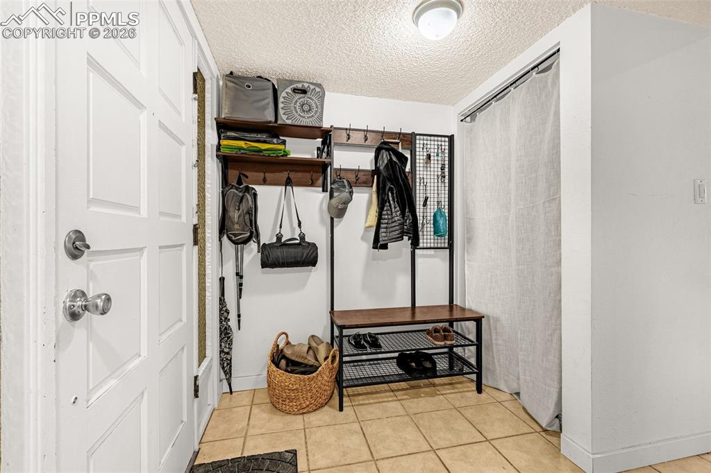 1018 Fontmore Road, Unit C Colorado Springs, CO 80904 - Photo 12 of 33 a view of walk in closet with clothes and shoes