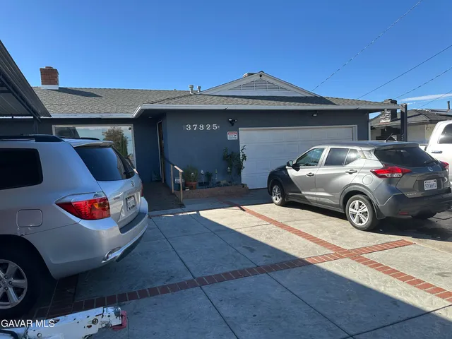a car parked in front of a house