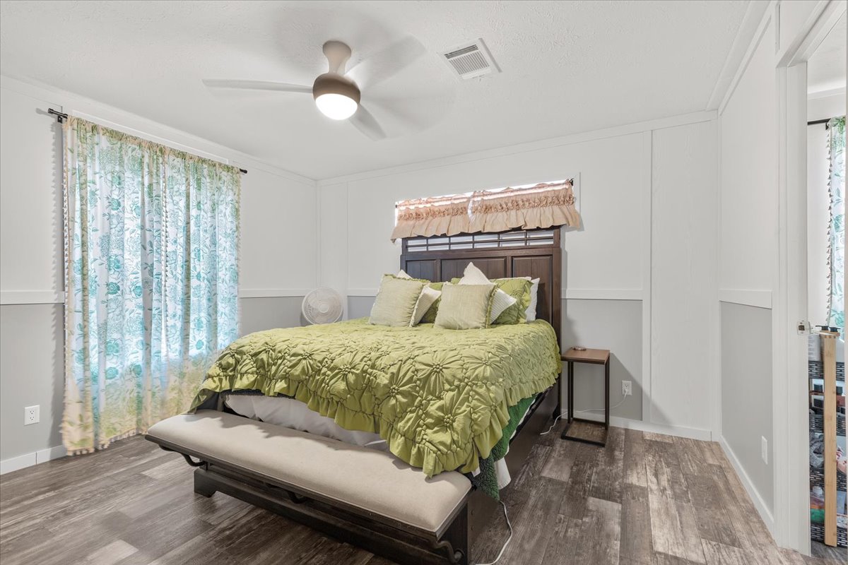 175 Wilson Road Elgin, TX 78621 - Photo 33 of 40 The bedroom in the guest house continues that bright, modern farmhouse theme. It’s a wonderfully cozy and quiet space for overnight guests to relax.
