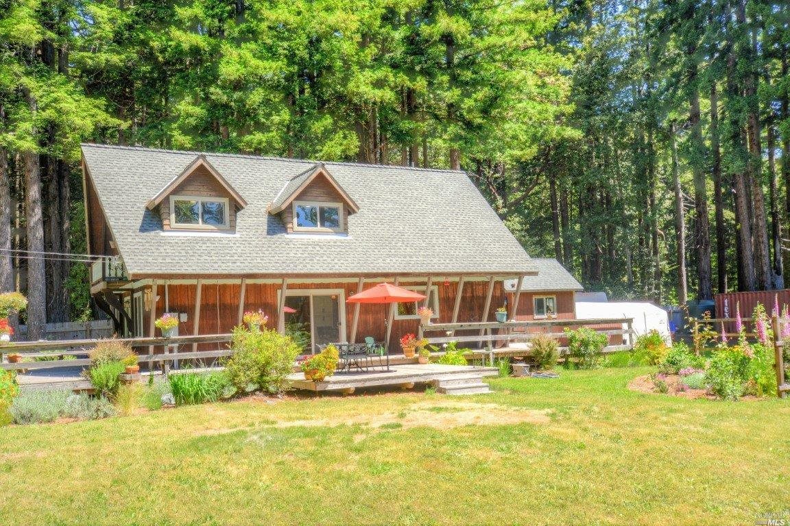 46201 Bill Owens Road Point Arena, CA 95468 - Photo 1 of 1 a front view of a house with swimming pool and porch