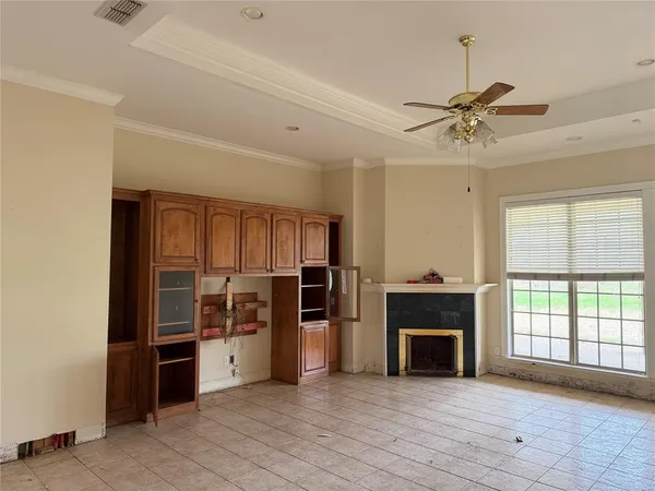 a view of an empty room and window