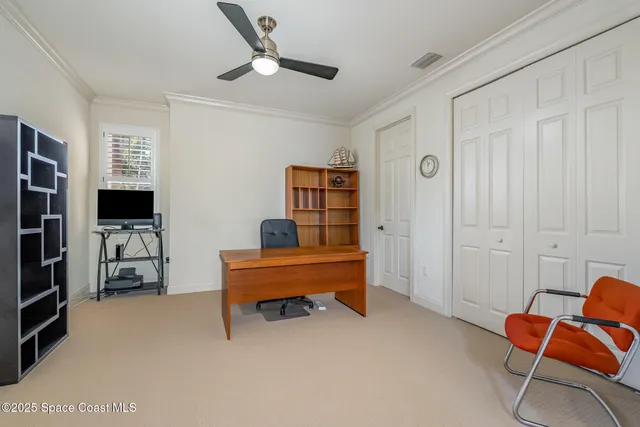 a view of a hallway with furniture