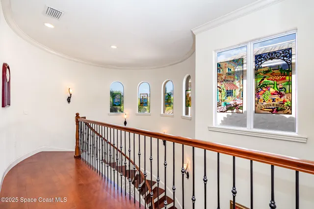a bedroom with a bed and a large mirror