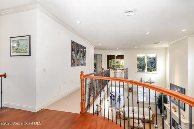 a view of balcony with wooden floor
