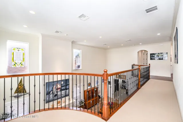 a large bathroom with a tub a sink and a large mirror