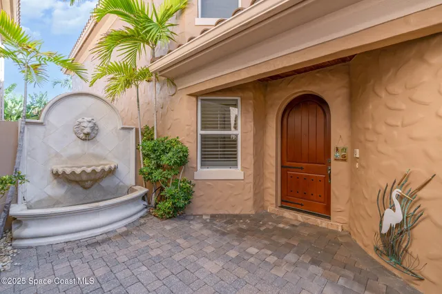 a view of a livingroom with furniture and a hallway