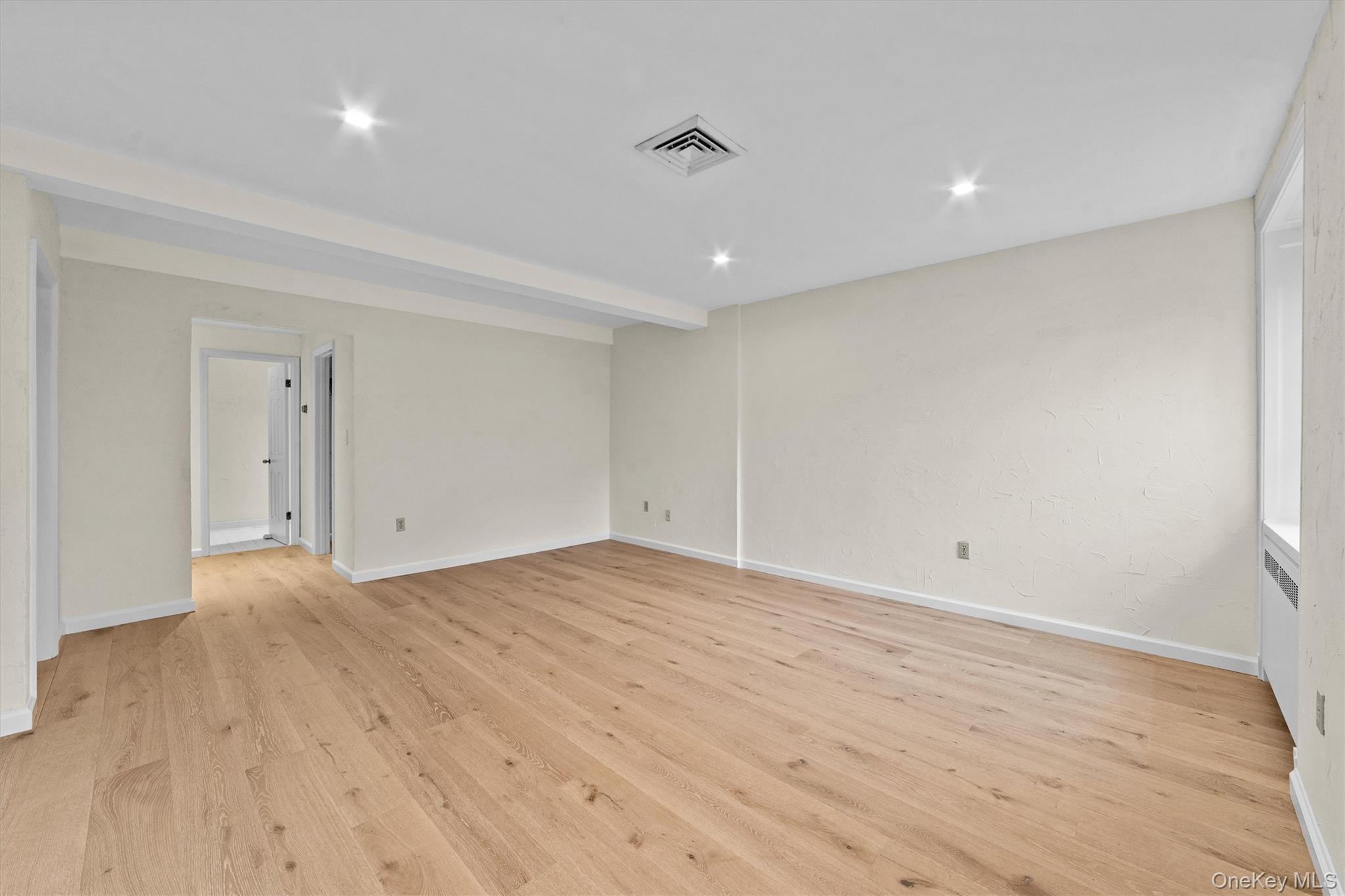 341 Furnace Dock Road, Unit 5 Cortlandt Manor, NY 10567 - Photo 18 of 41 a view of room with wooden floor and natural light