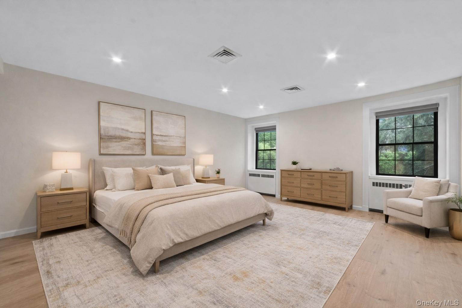 341 Furnace Dock Road, Unit 5 Cortlandt Manor, NY 10567 - Photo 19 of 41 a bedroom with a bed wooden floor and furniture