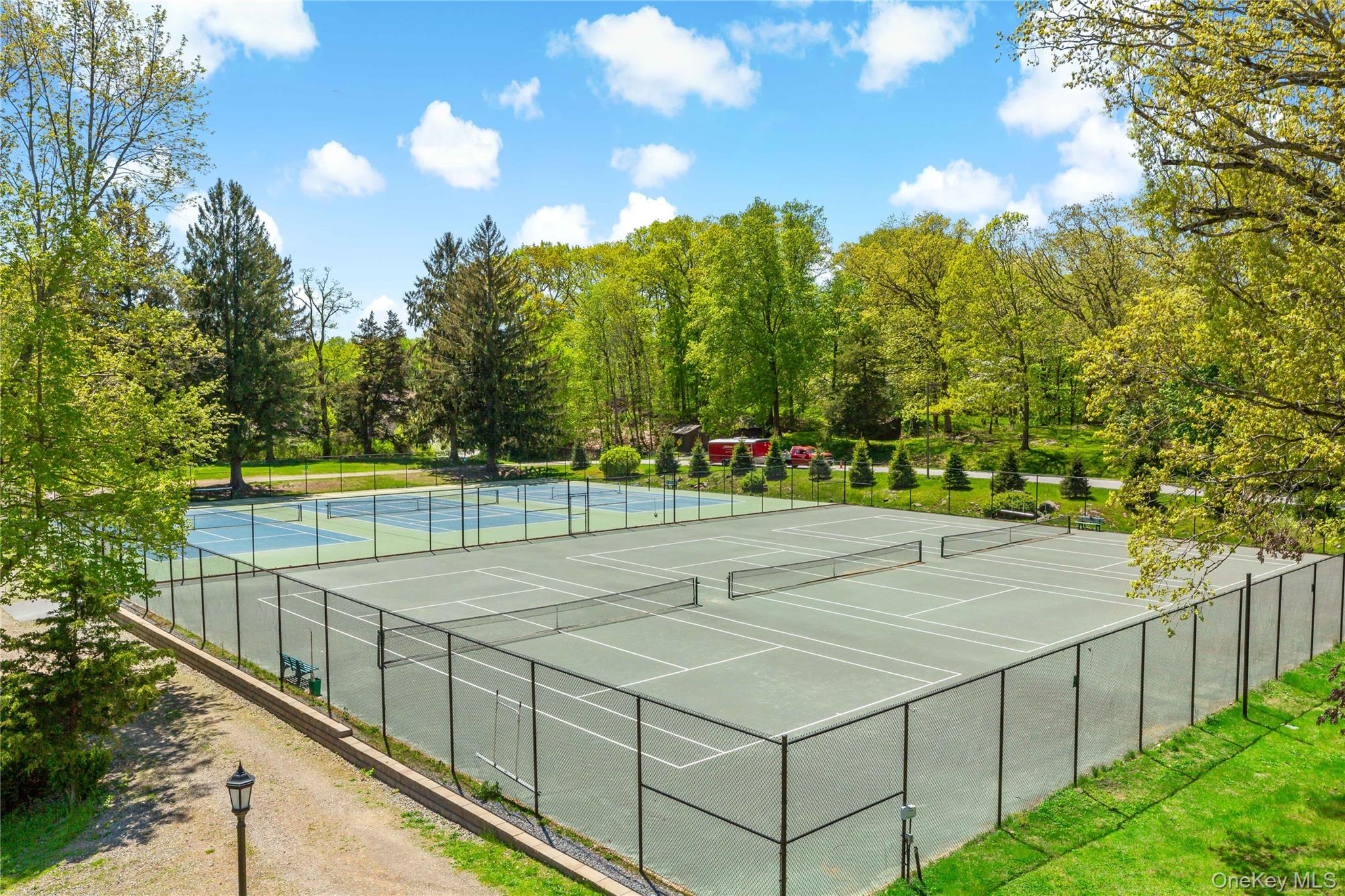 341 Furnace Dock Road, Unit 5 Cortlandt Manor, NY 10567 - Photo 35 of 41 a view of an outdoor space and tennis court