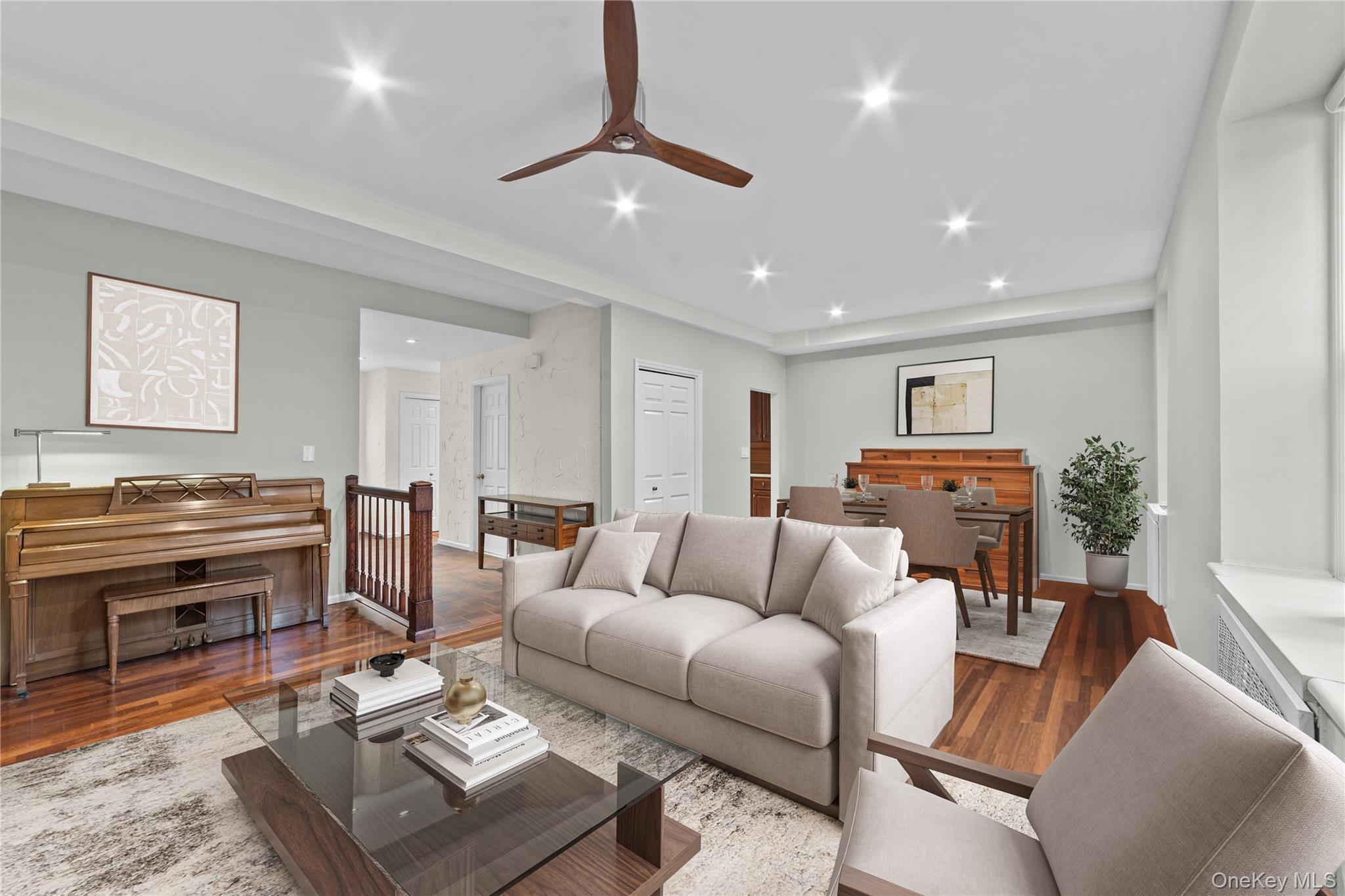 341 Furnace Dock Road, Unit 5 Cortlandt Manor, NY 10567 - Photo 7 of 41 a living room with furniture and a piano