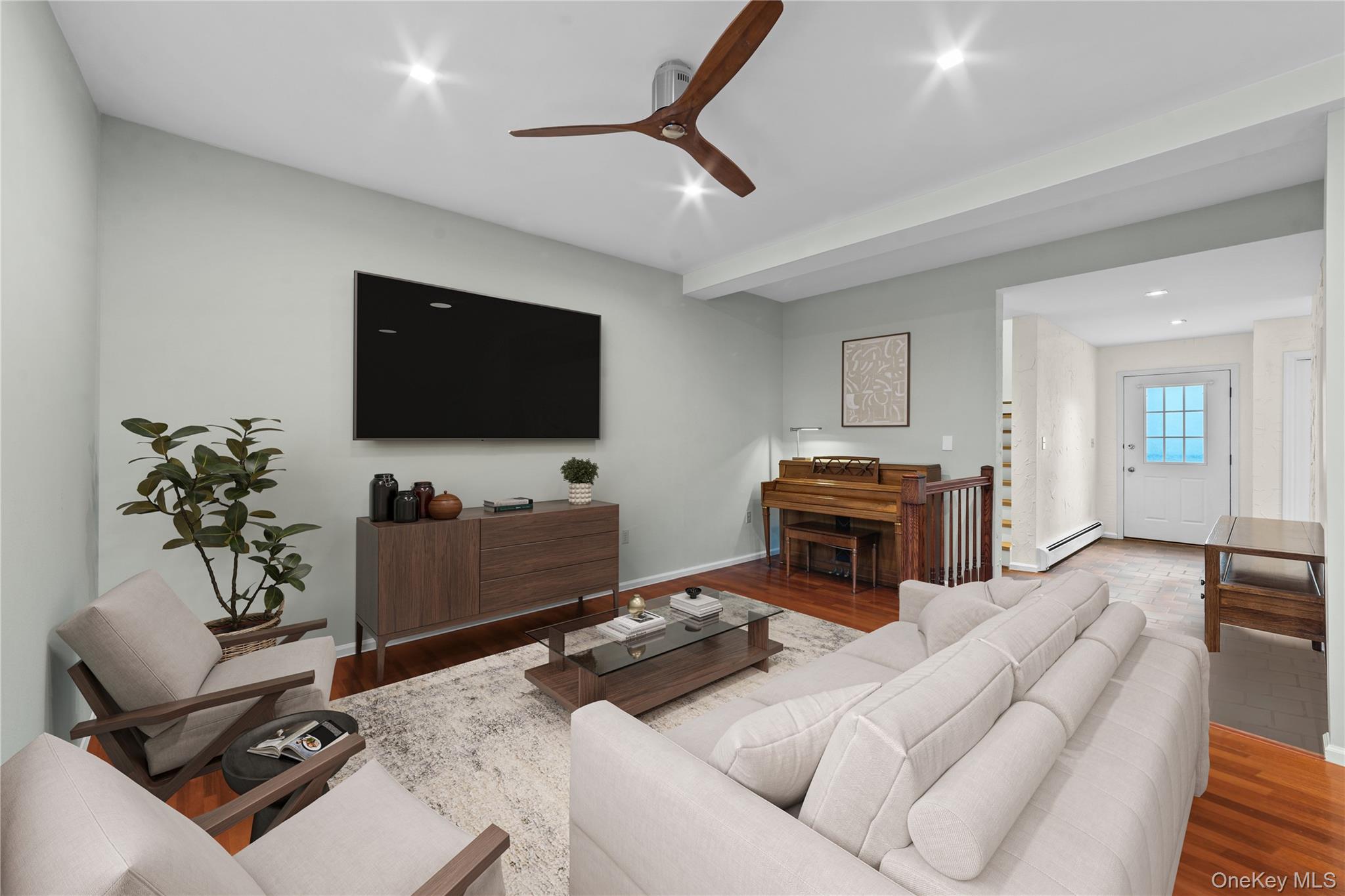 341 Furnace Dock Road, Unit 5 Cortlandt Manor, NY 10567 - Photo 8 of 41 a living room with furniture and a flat screen tv