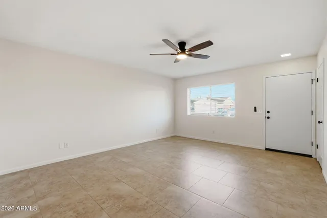 a view of an empty room with a window