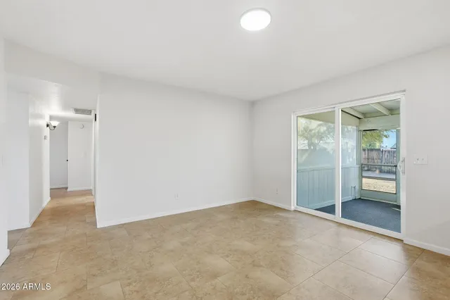 an empty room with mirror