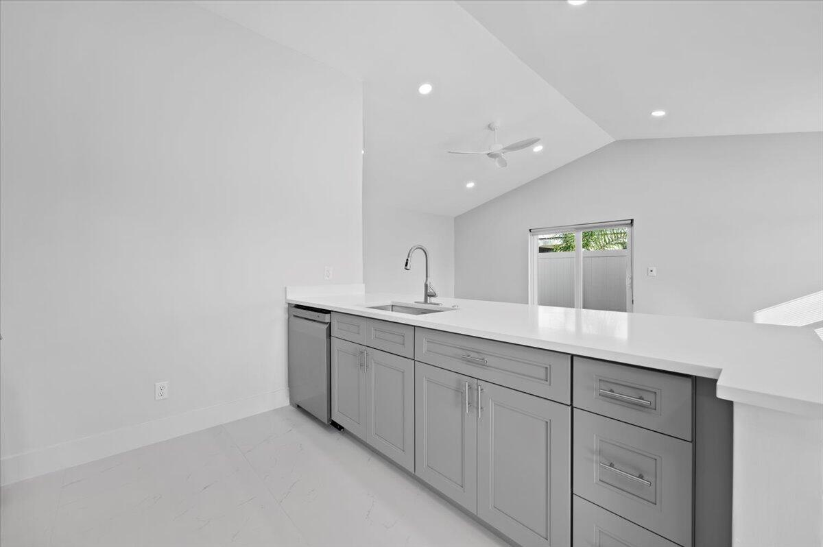 196 Raintree Trail Jupiter, FL 33458 - Photo 11 of 28 a bathroom with a double vanity sink and mirror