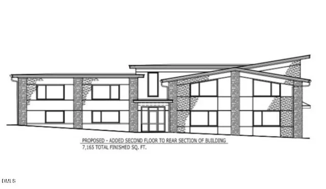 a black and white photo of a living room