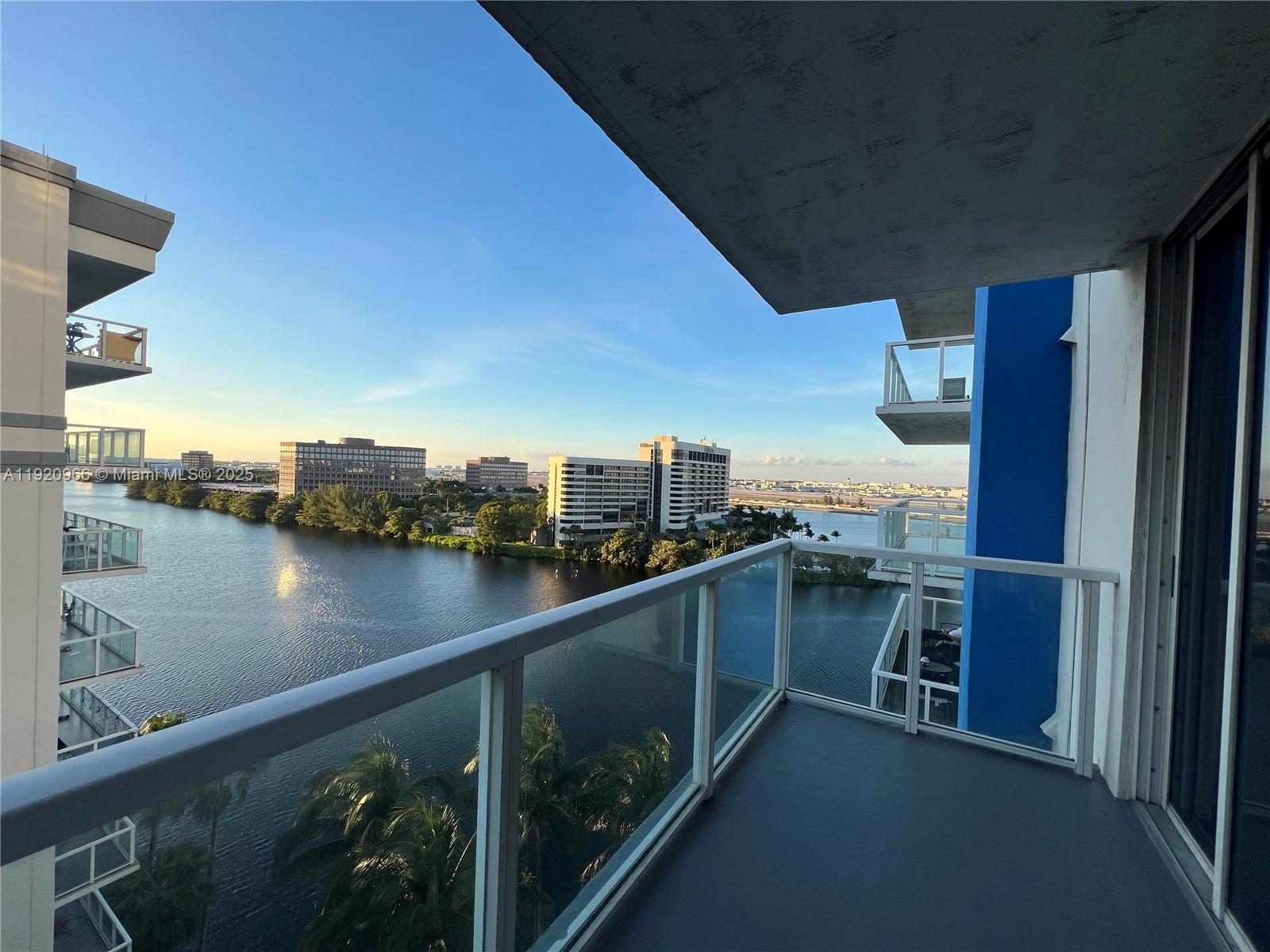 a view of a balcony next to a yard