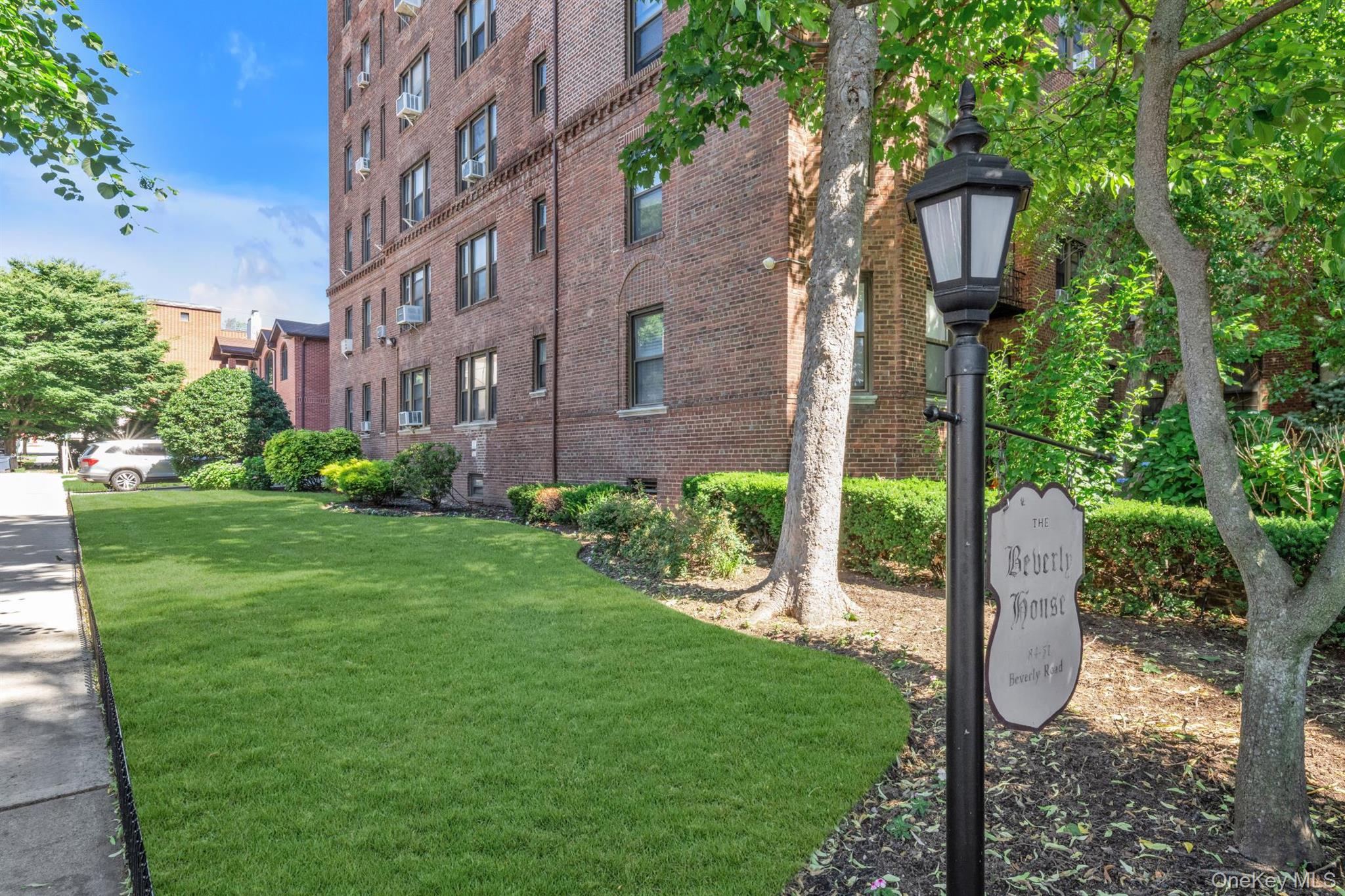 84-51 Beverly Road, Unit 6A Queens, NY 11415 - Photo 13 of 14 a view of a yard in front of a building