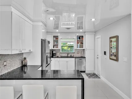 a living room with fireplace furniture and a flat screen tv
