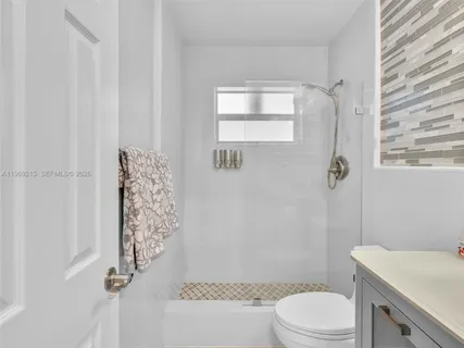 an aerial view of a house with yard swimming pool and outdoor seating