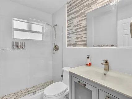 an aerial view of a house with swimming pool