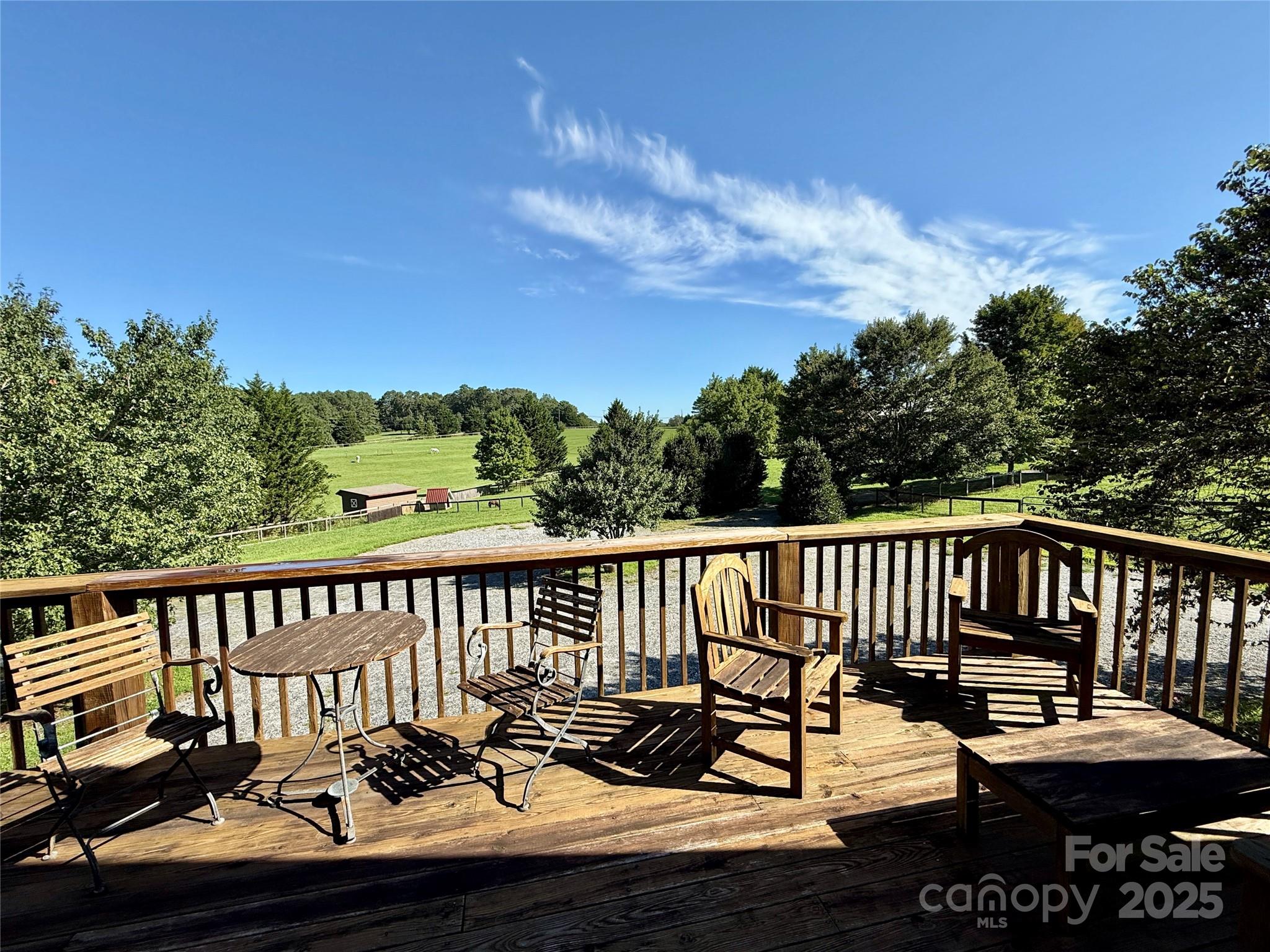 226 John Smith Road Columbus, NC 28722 - Photo 23 of 48 a view of a two chairs on the deck