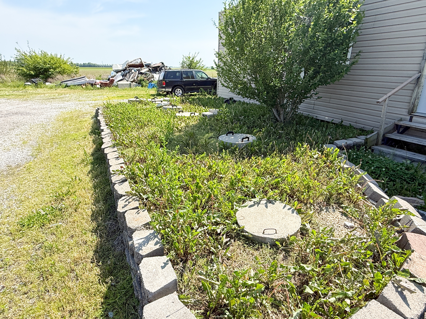 5991 Kinmundy Road Louisville, IL 62858 - Photo 11 of 12 a view of a backyard with plants and lake view