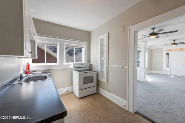 a view of a kitchen with a sink