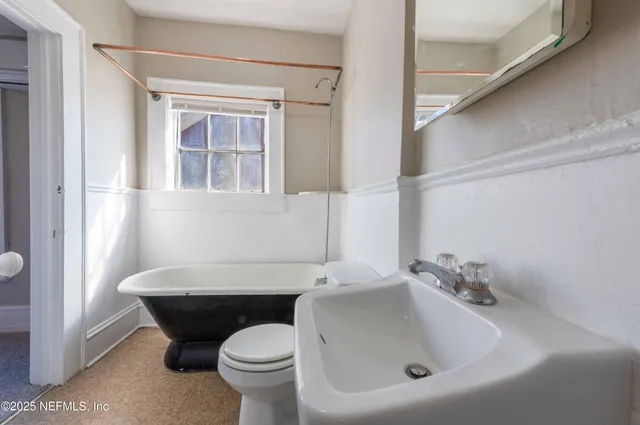 a bathroom with a sink and a toilet