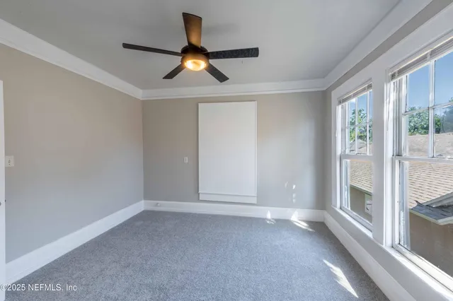 a view of empty room with windows